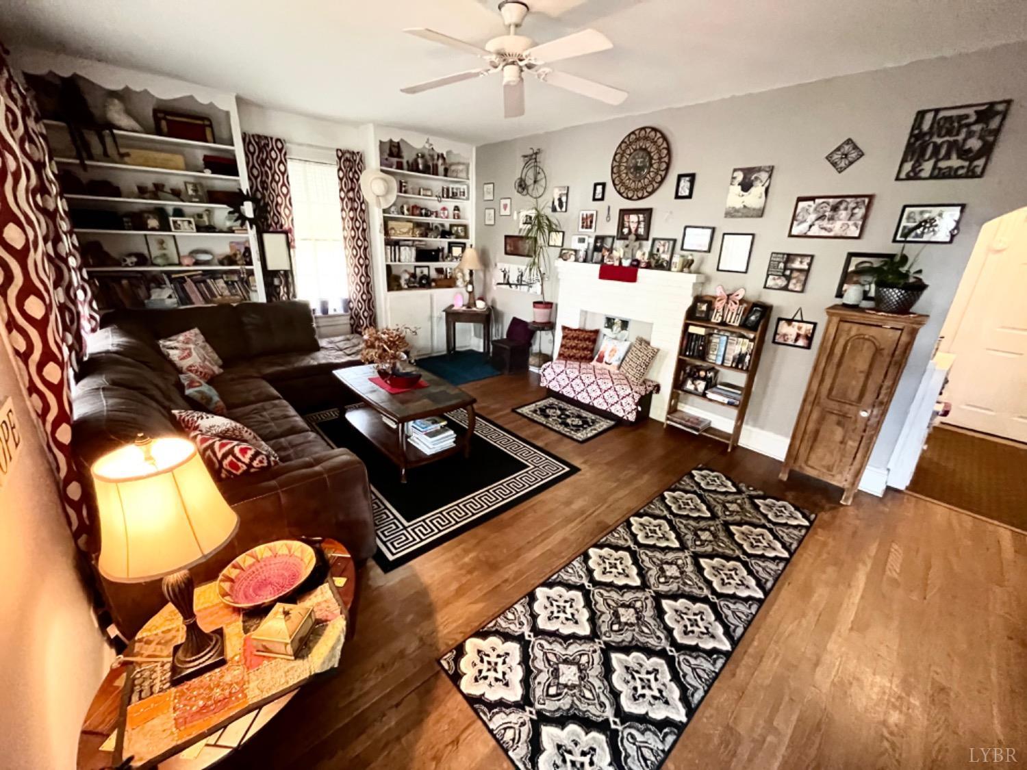 165 Cedar Gate Road Monroe, VA 24574 - Photo 16 of 37 a living room with furniture and wooden floor
