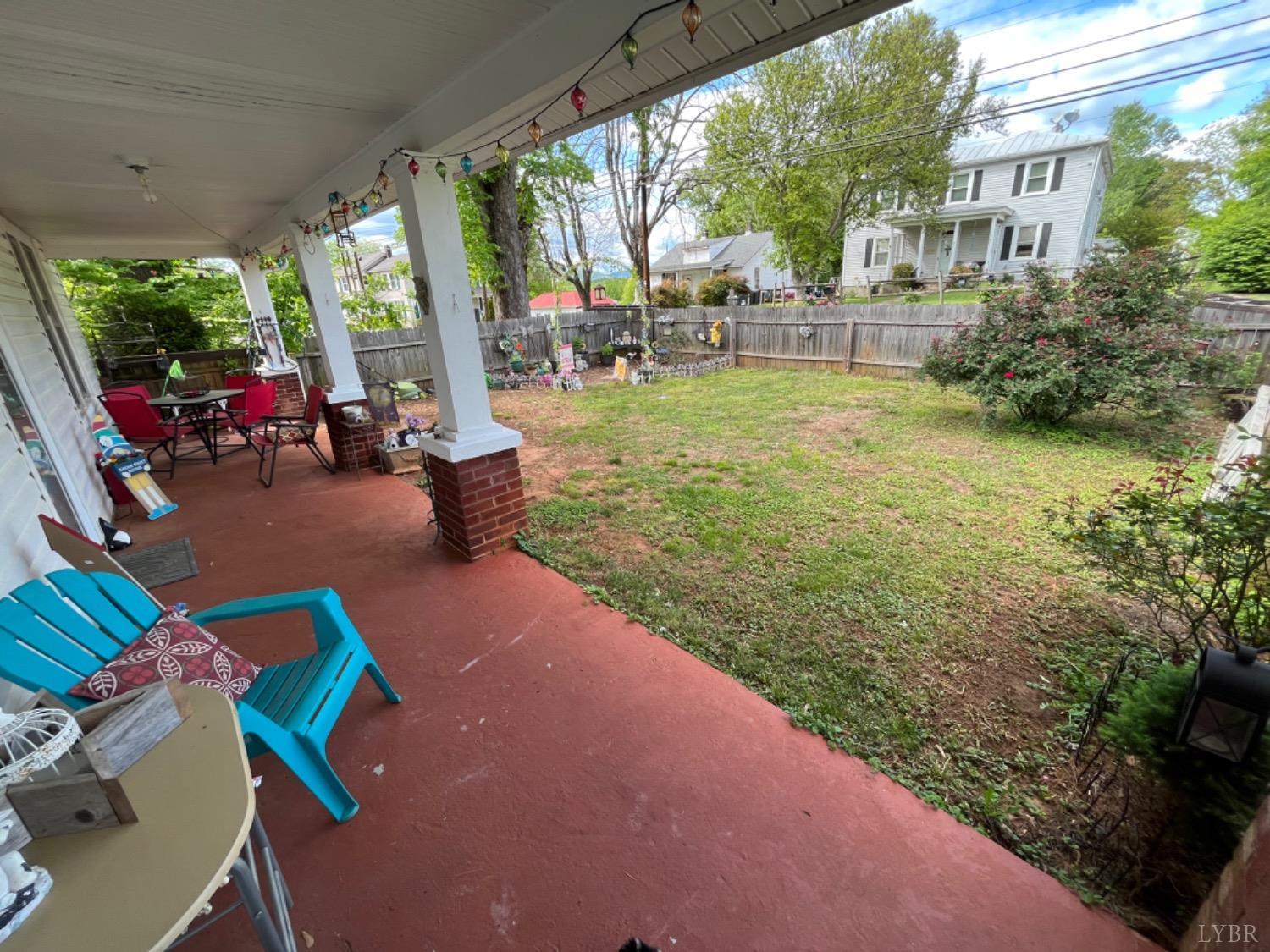 165 Cedar Gate Road Monroe, VA 24574 - Photo 5 of 37 a view of a patio with couches table and chairs and potted plants