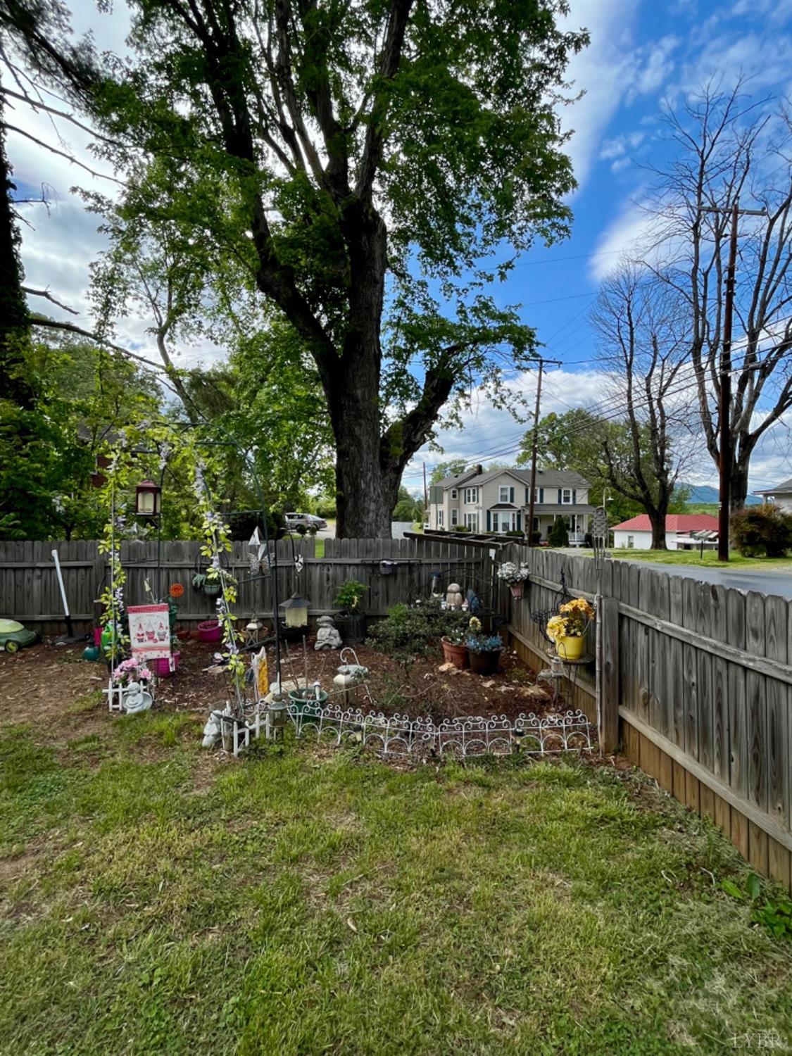 165 Cedar Gate Road Monroe, VA 24574 - Photo 6 of 37 a view of a chair and table in backyard of the house