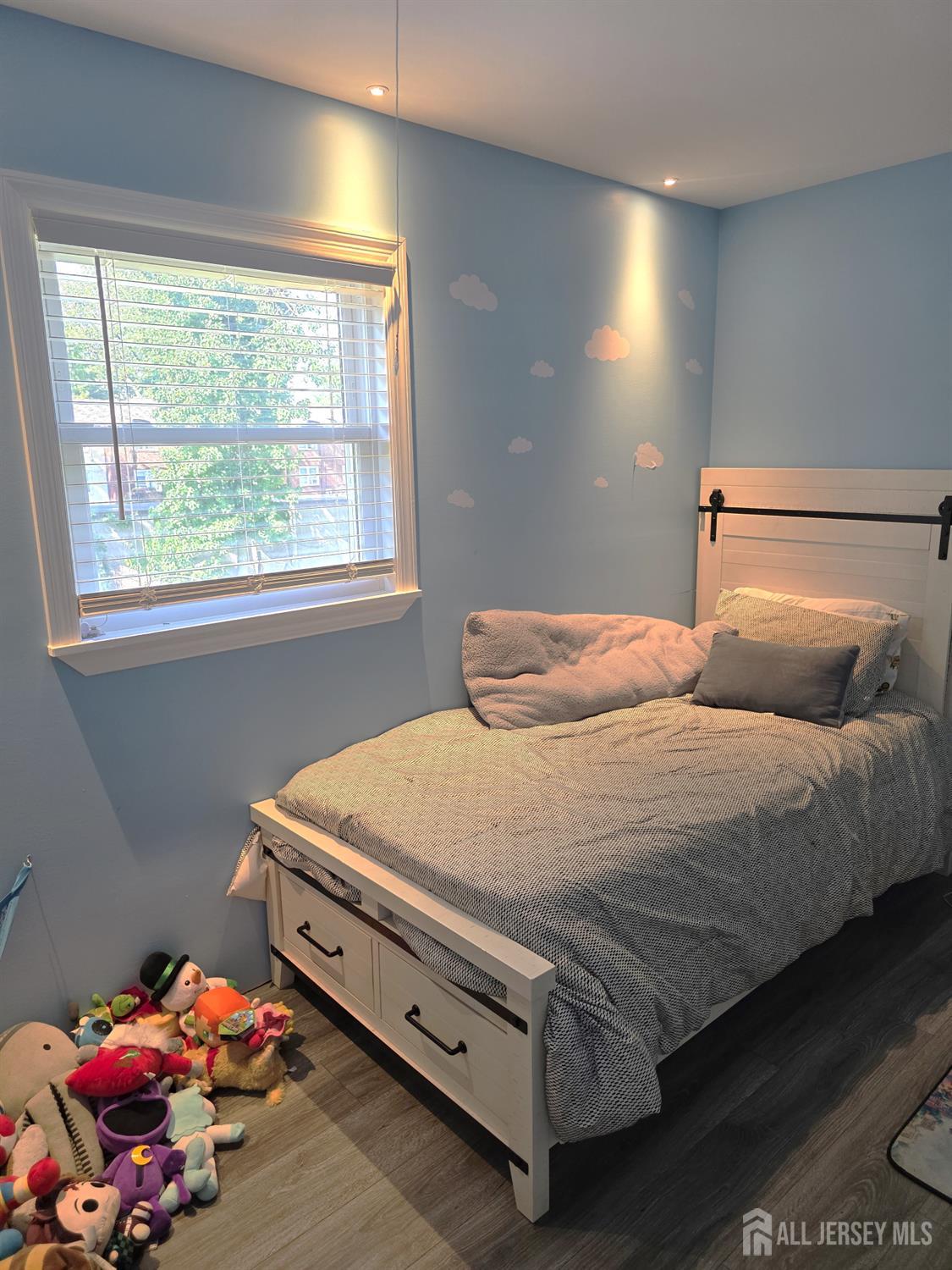 382 Douglas Road Roselle, NJ 07203 - Photo 12 of 17 a bedroom with a bed and a window