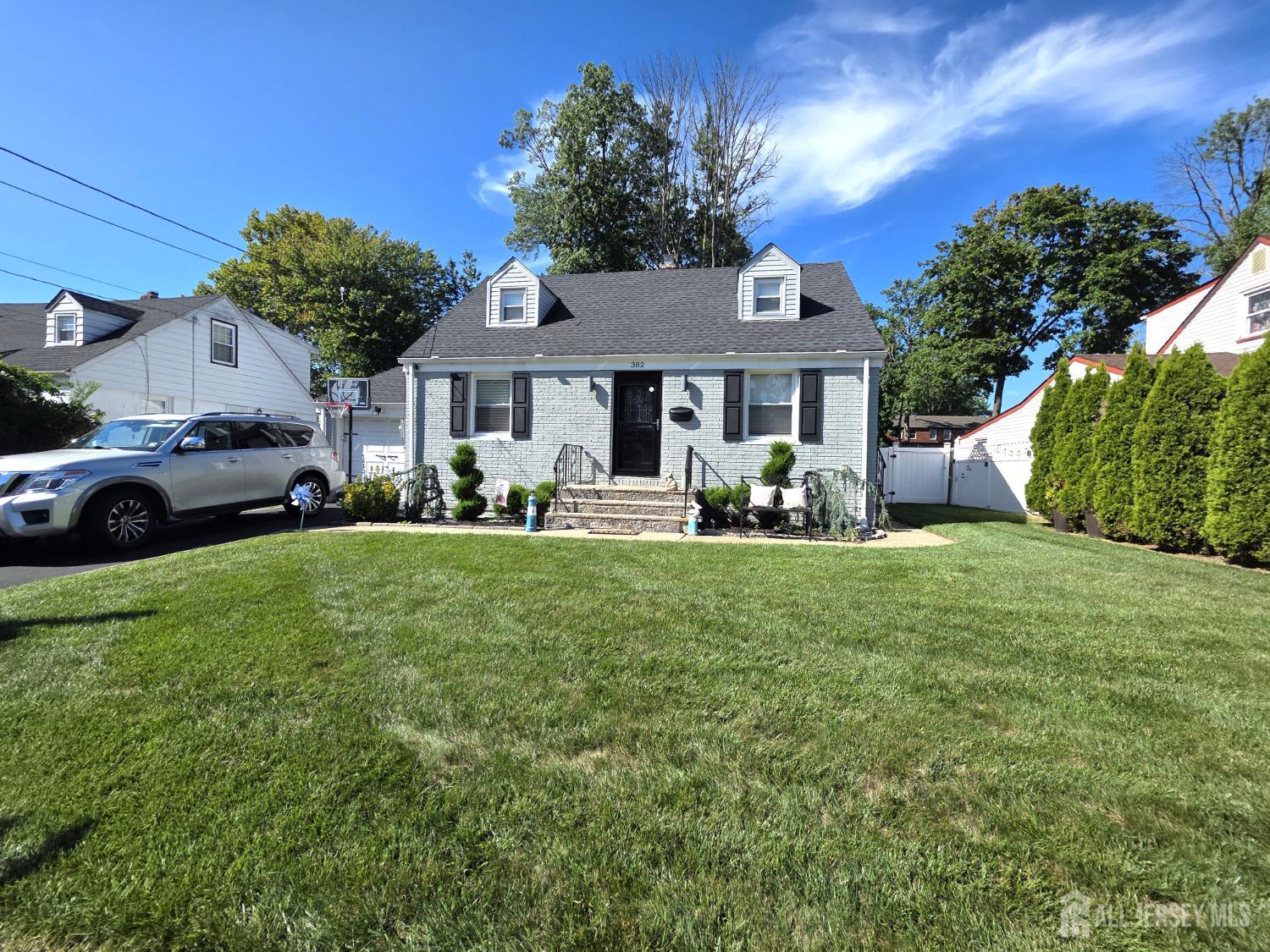 382 Douglas Road Roselle, NJ 07203 - Photo 2 of 17 a front view of a house with garden