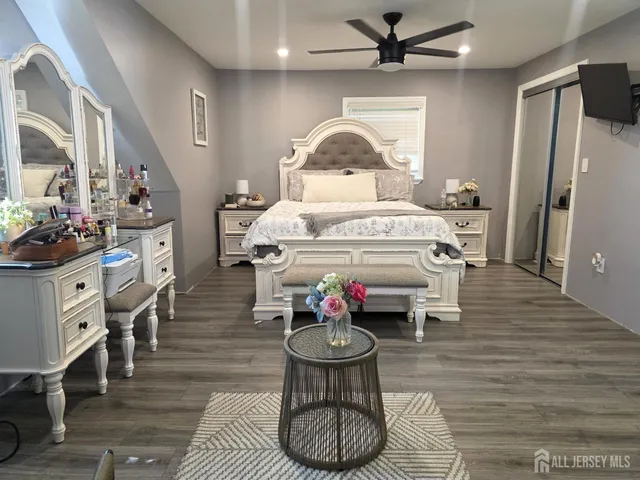 a kitchen with a stove a chimney a table and chairs