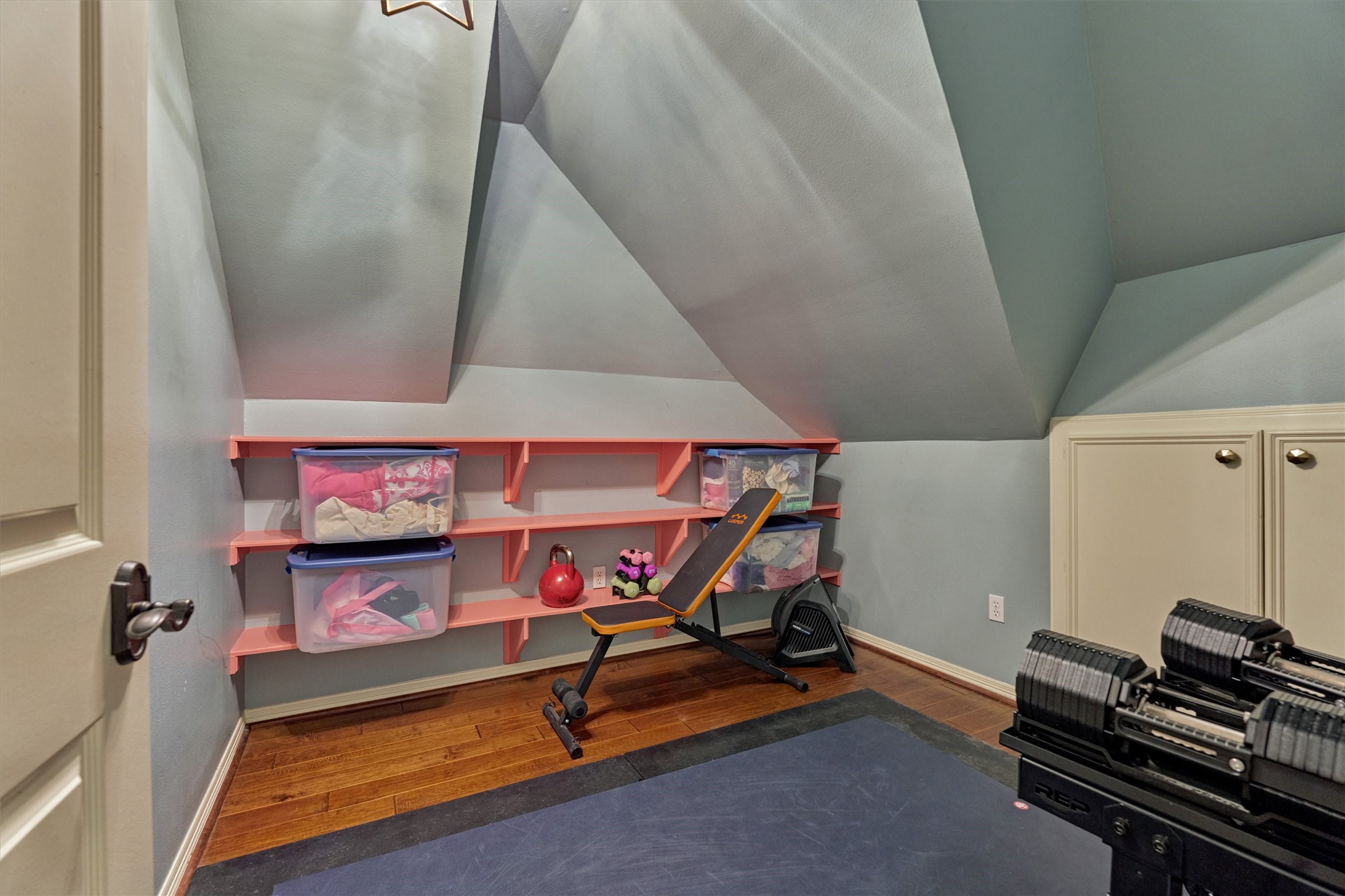 18 Treevine Court The Woodlands, TX 77381 - Photo 35 of 50 Versatile bonus room upstairs offers endless possibilities—use it as additional storage, a home gym, hobby room, or whatever best suits your needs.