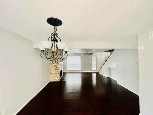 a view of entryway and hall with a chandelier
