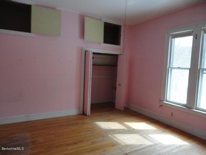 11 Albany Road West Stockbridge, MA 01266 - Photo 22 of 39 a view of an empty room with a window and wooden floor