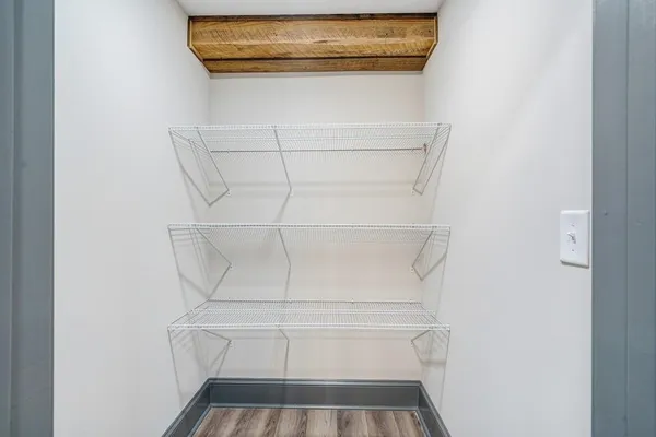 a view of storage and utility room with closet