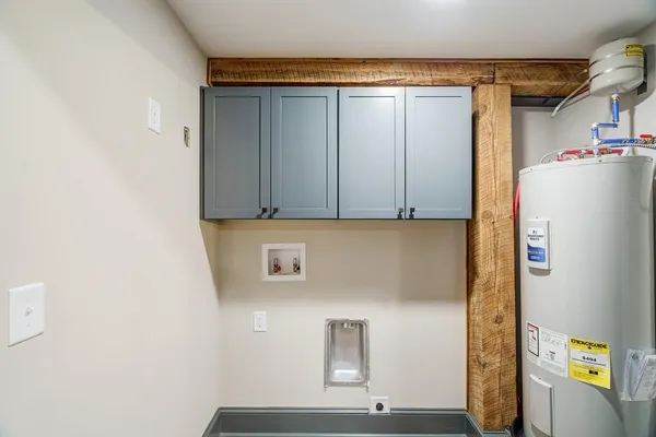 a stove top oven sitting inside of a kitchen