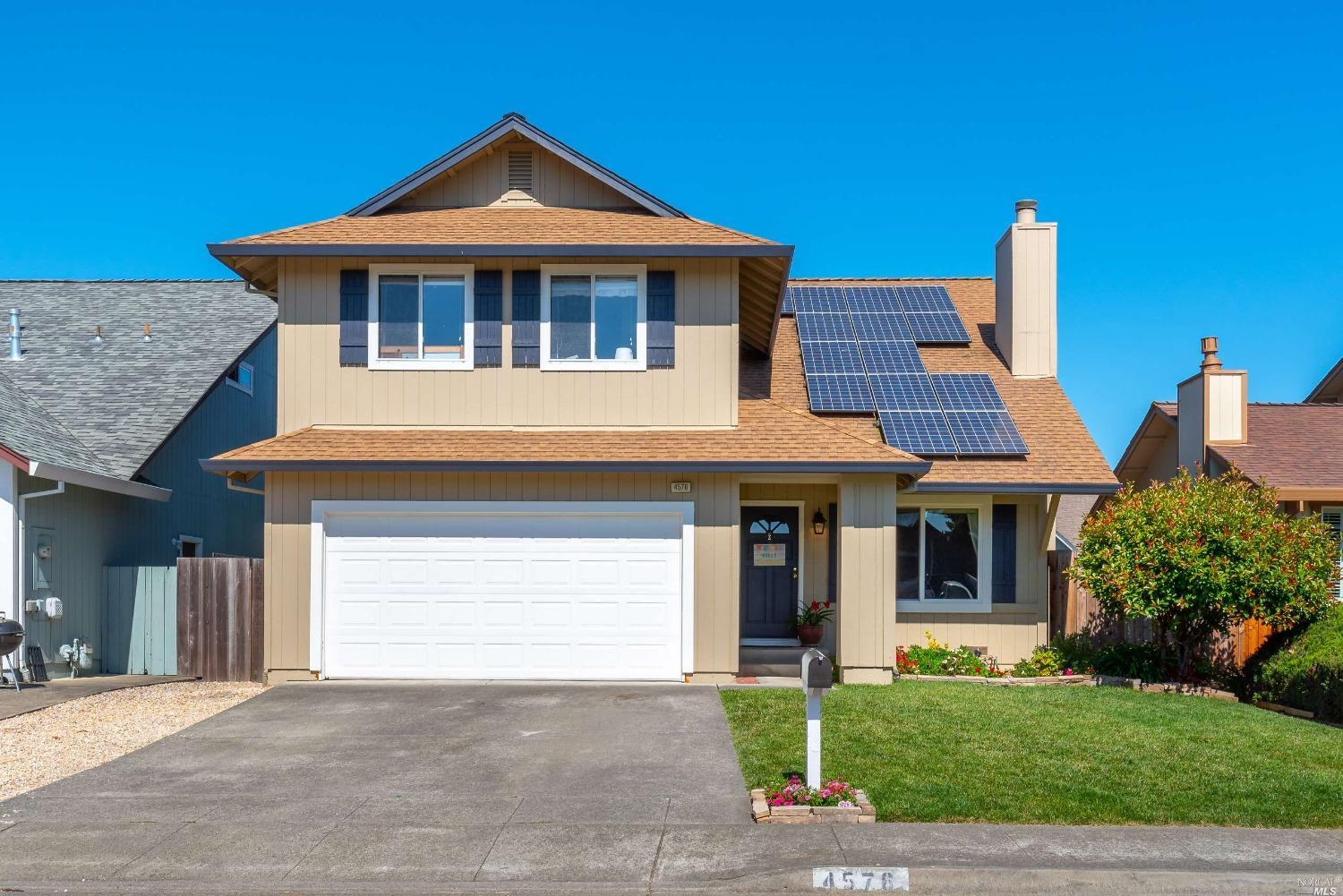 4576 Harmony Place Rohnert Park, CA 94928 - Photo 1 of 1 a front view of a house with a yard and garage
