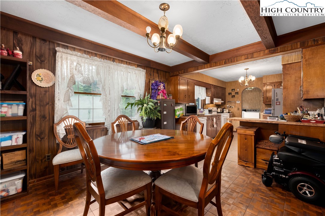 1546 Stage Road Mountain City, TN 37683 - Photo 11 of 48 a view of a dining room with furniture window and wooden floor