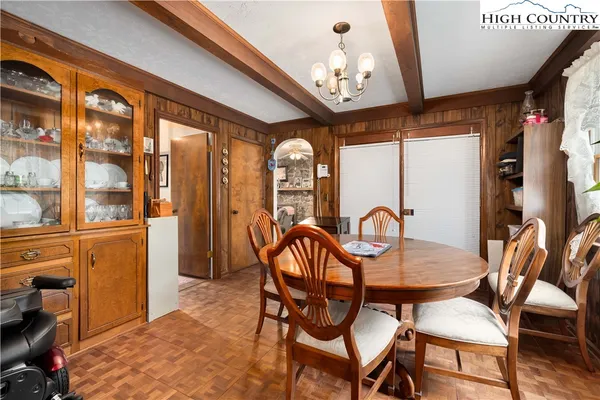 a kitchen with refrigerator and cabinets