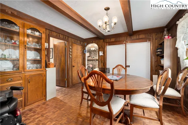 a kitchen with refrigerator and cabinets