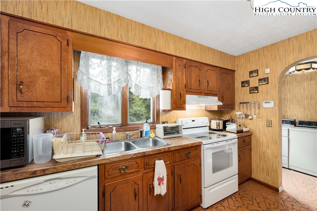 1546 Stage Road Mountain City, TN 37683 - Photo 15 of 48 a kitchen with appliances a sink and cabinets