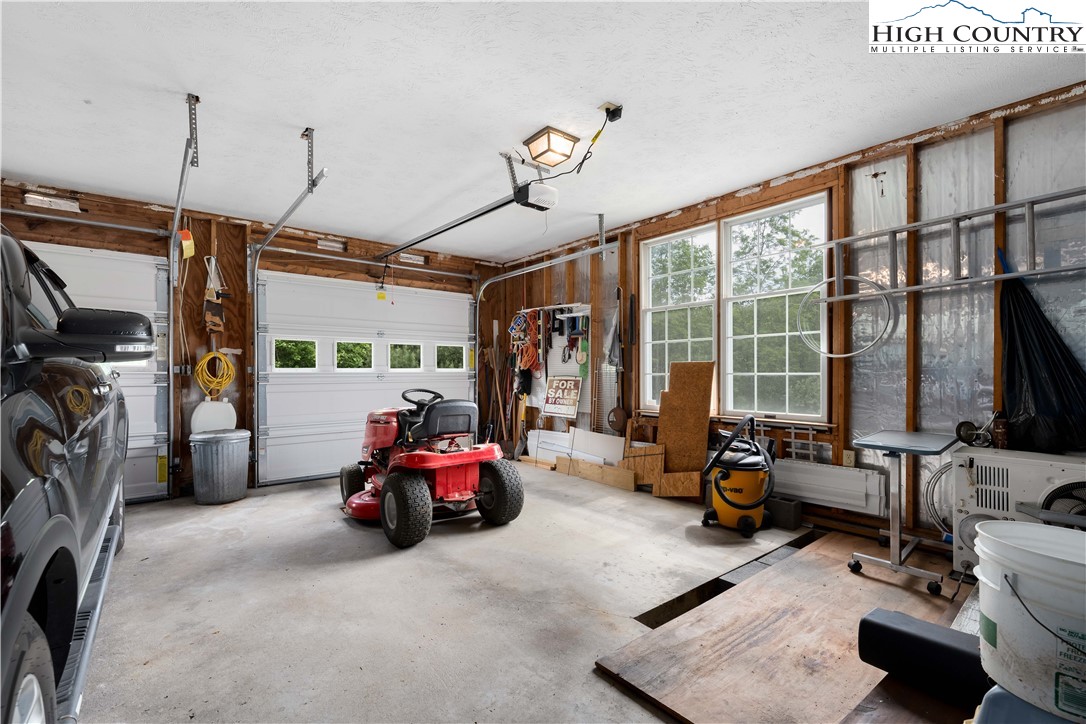 1546 Stage Road Mountain City, TN 37683 - Photo 18 of 48 a view of gym equipment with a view of living room