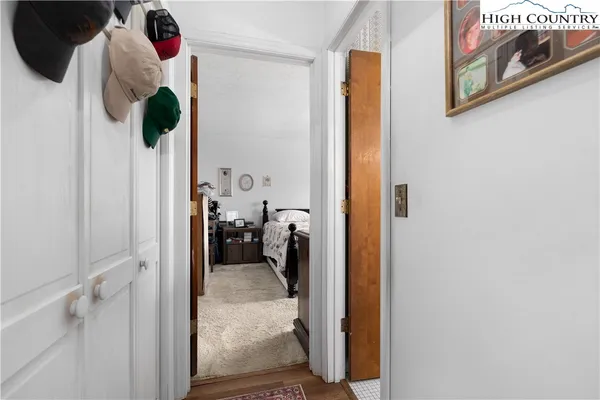 a bathroom with a double vanity sink toilet and a mirror