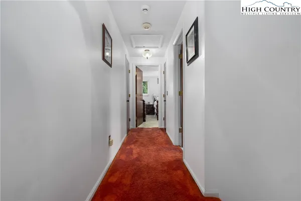 a bedroom with a bed and a table