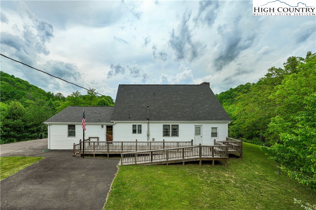 1546 Stage Road Mountain City, TN 37683 - Photo 41 of 48 a aerial view of a house with a yard and sitting area