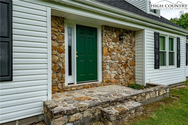 a view of a park with large trees