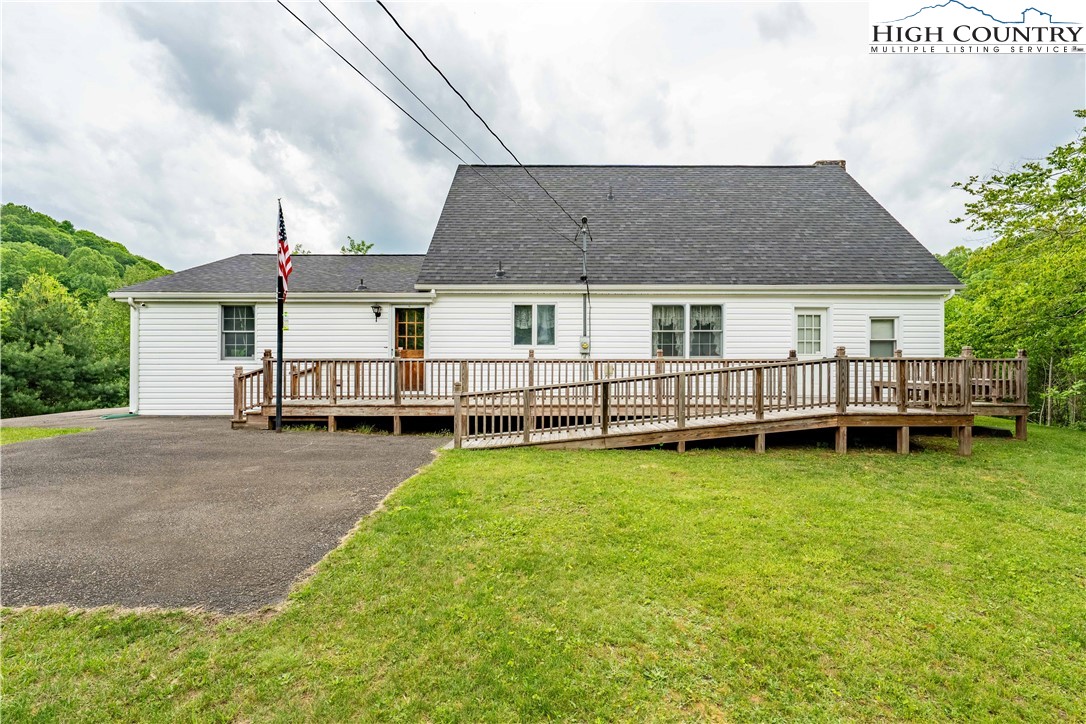 1546 Stage Road Mountain City, TN 37683 - Photo 45 of 48 a view of a house with a yard and deck