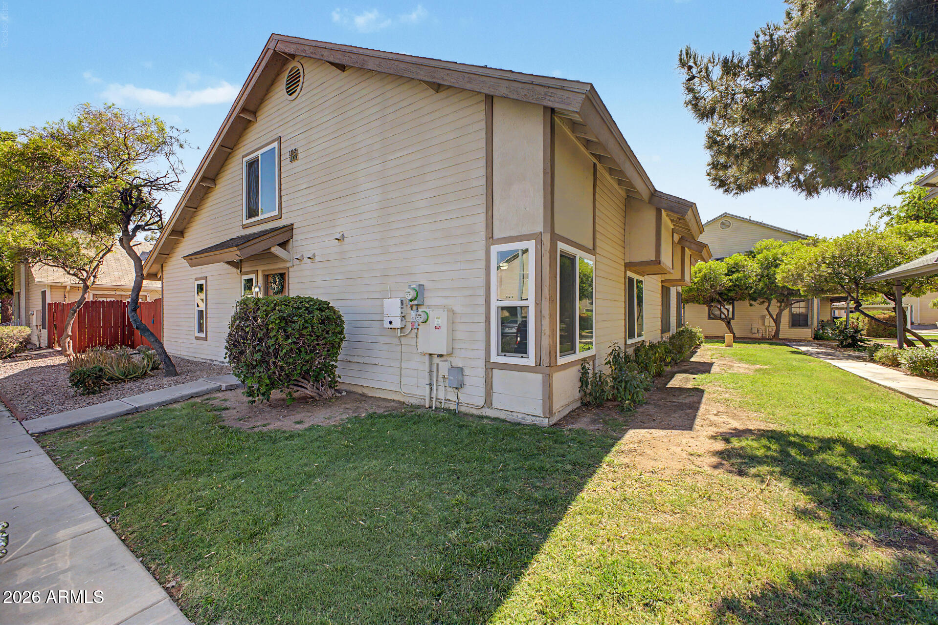 2455 East Broadway Road, Unit 103 Mesa, AZ 85204 - Photo 1 of 22 a view of a house with a yard