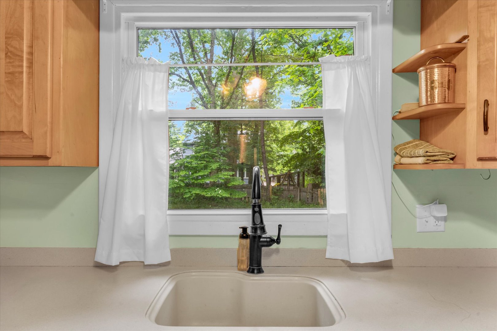 58 Woodhill Court Decatur, IL 62521 - Photo 11 of 29 a kitchen with a sink and garden view