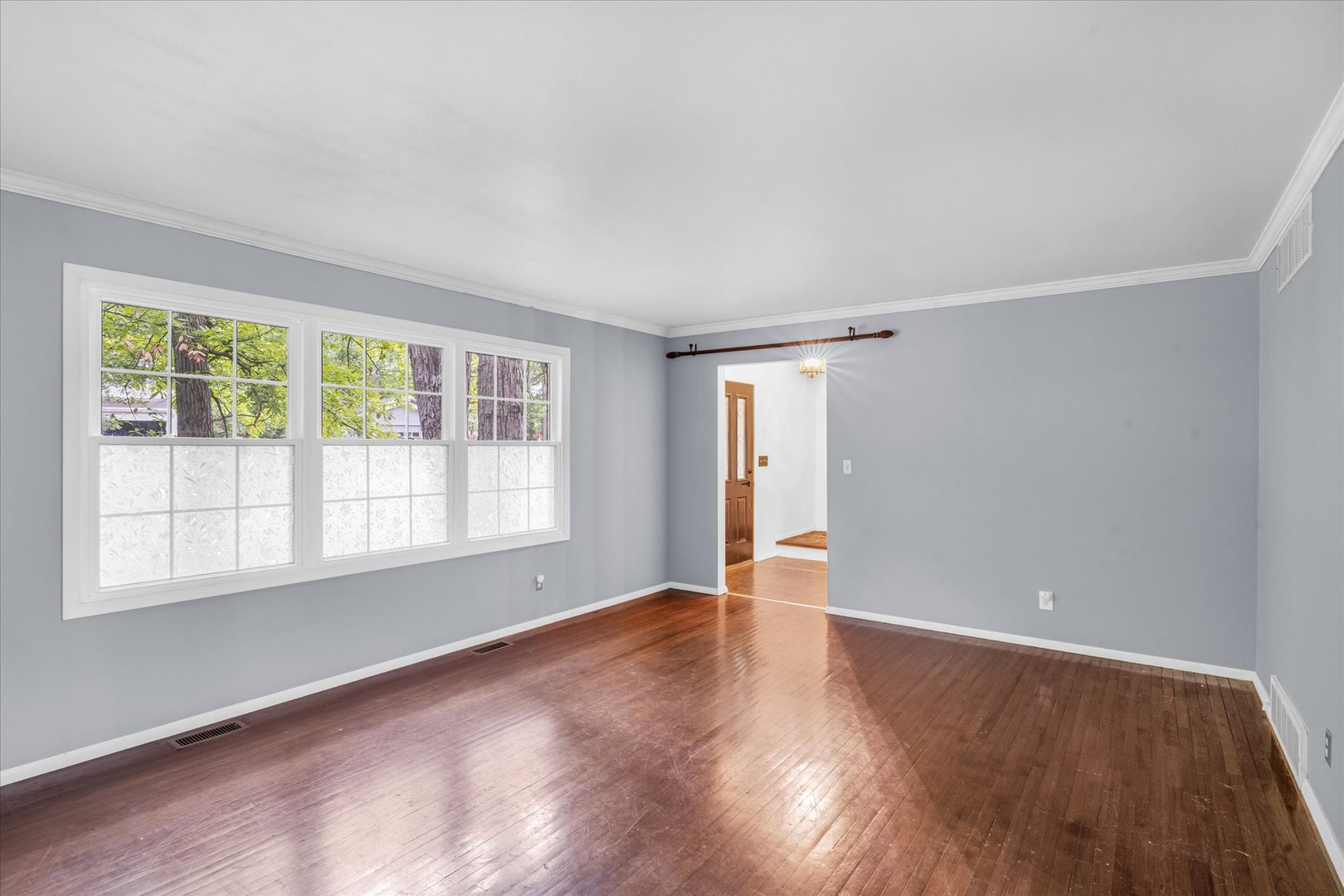 58 Woodhill Court Decatur, IL 62521 - Photo 14 of 29 an empty room with wooden floor and windows