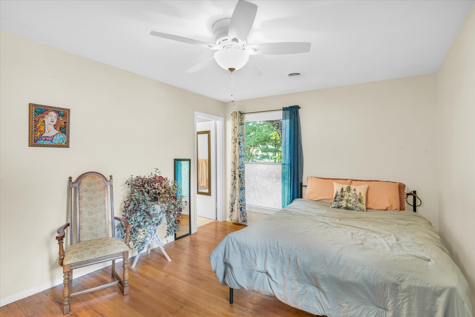 58 Woodhill Court Decatur, IL 62521 - Photo 16 of 29 a bedroom with a large bed a chandelier and a window