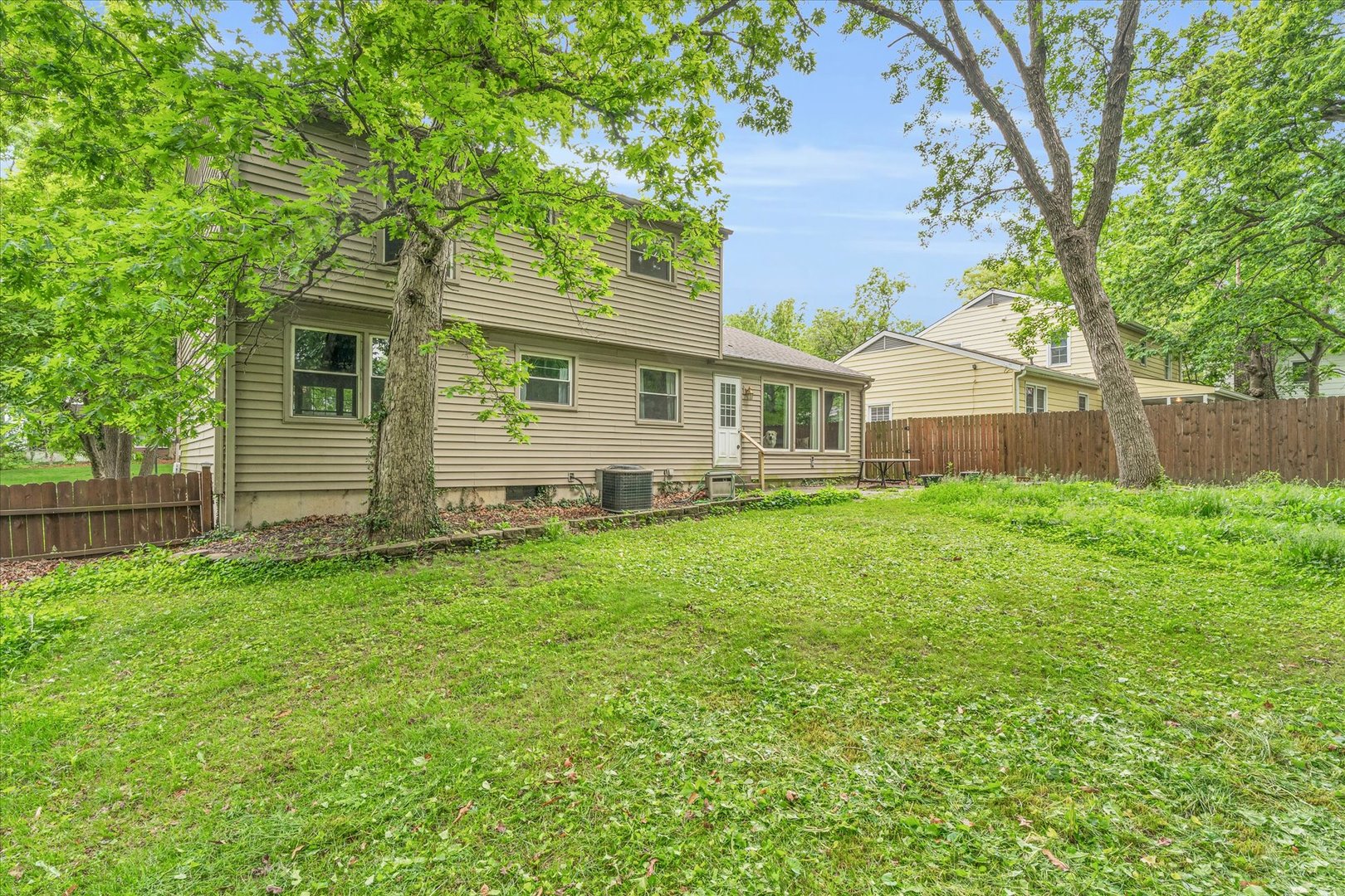 58 Woodhill Court Decatur, IL 62521 - Photo 27 of 29 a front view of a house with a garden and yard