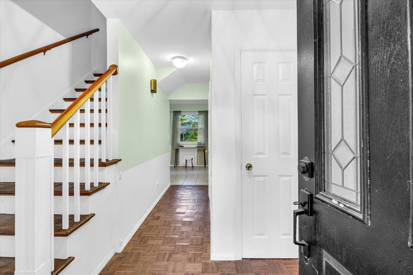 58 Woodhill Court Decatur, IL 62521 - Photo 4 of 29 a view of a hallway with wooden floor and staircase