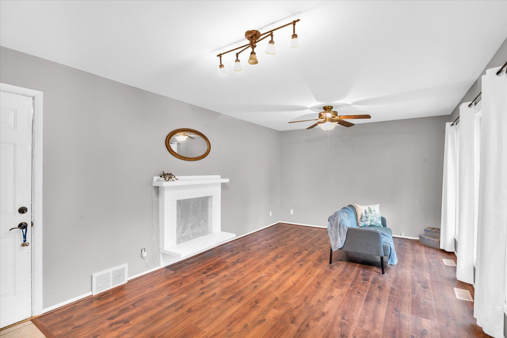 58 Woodhill Court Decatur, IL 62521 - Photo 6 of 29 a view of empty room with wooden floor and fan
