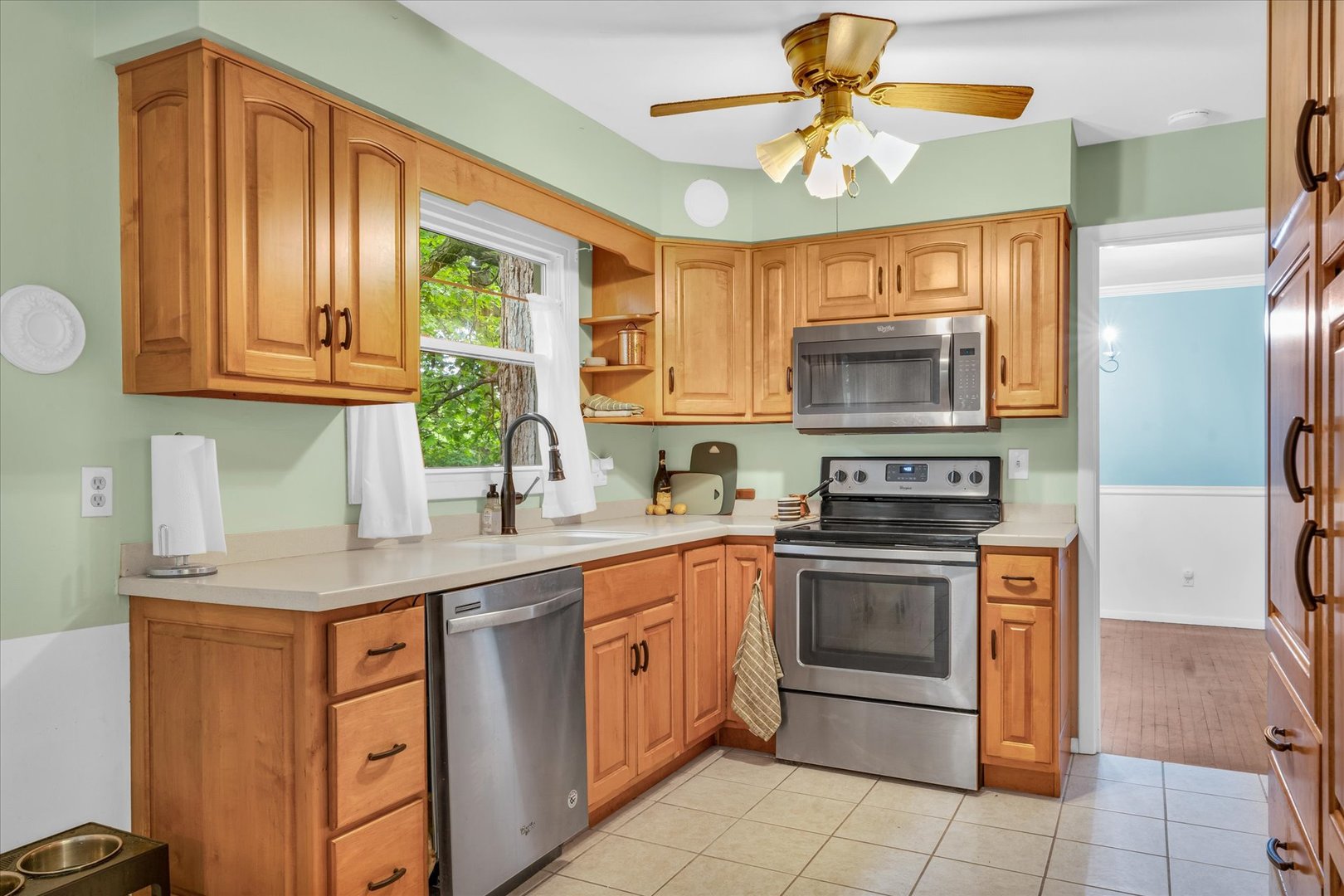 58 Woodhill Court Decatur, IL 62521 - Photo 9 of 29 a kitchen with stainless steel appliances granite countertop a stove a sink and a microwave