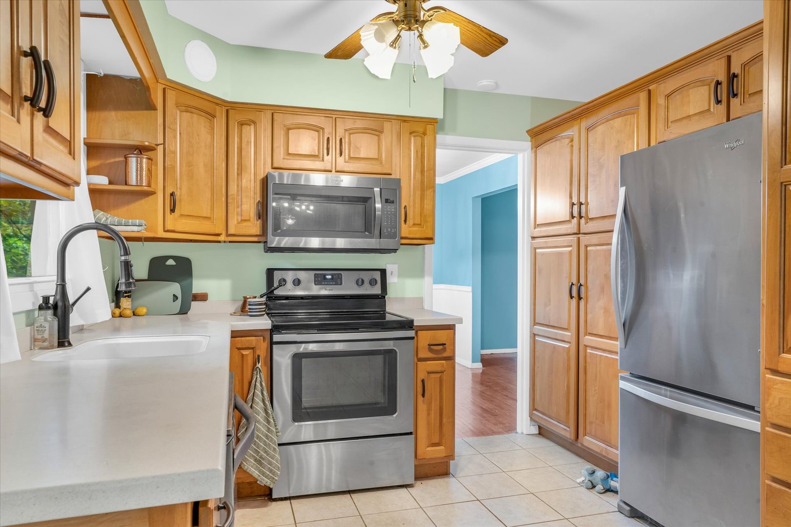58 Woodhill Court Decatur, IL 62521 - Photo 10 of 29 a kitchen with stainless steel appliances granite countertop a refrigerator stove and sink