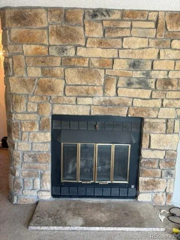 a fireplace with a glass door