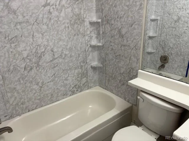 a bathroom with a sink and toilet