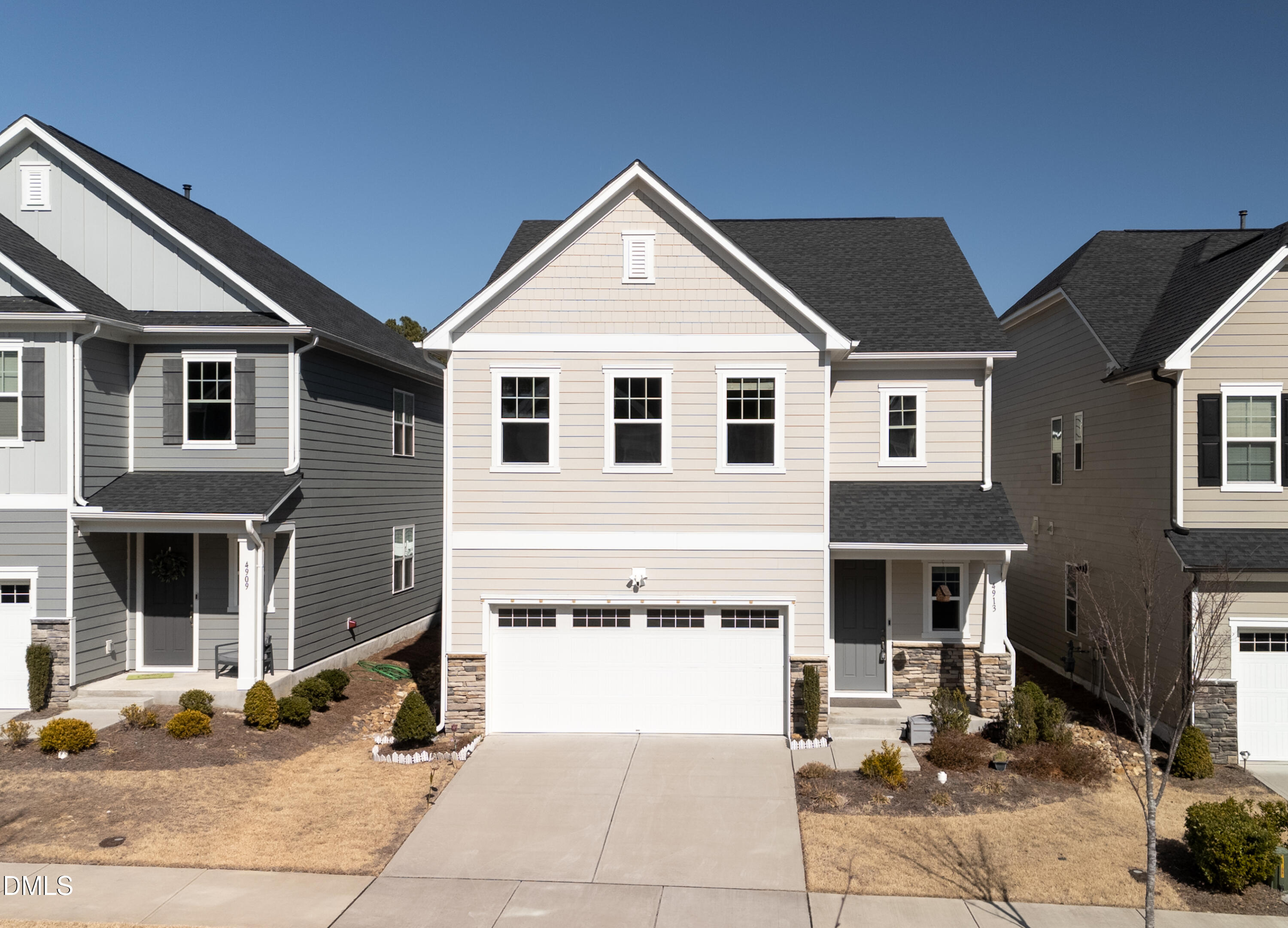 a front view of a house with yard