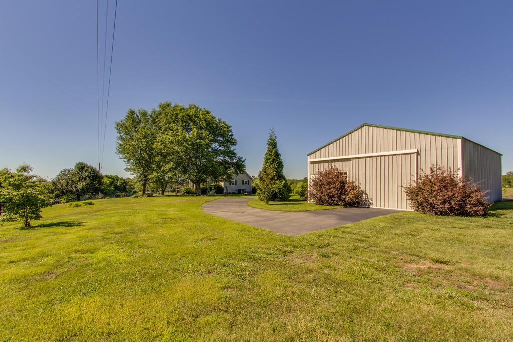 2352 Tom Fitzgerald Road Columbia, TN 38401 - Photo 2 of 30 a view of a house with a yard and a large tree