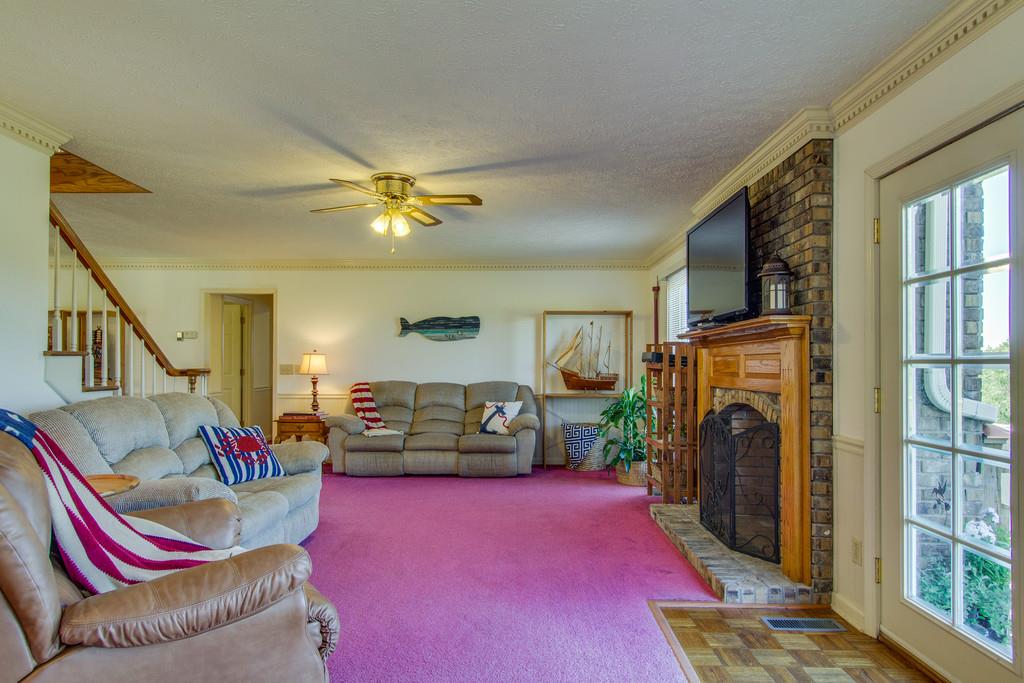 2352 Tom Fitzgerald Road Columbia, TN 38401 - Photo 13 of 30 a living room with furniture flat screen tv and a fireplace