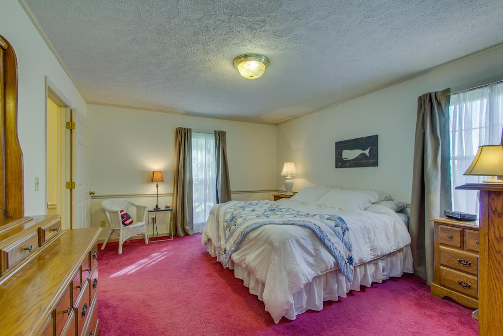 2352 Tom Fitzgerald Road Columbia, TN 38401 - Photo 15 of 30 a spacious bedroom with a bed and a lamp