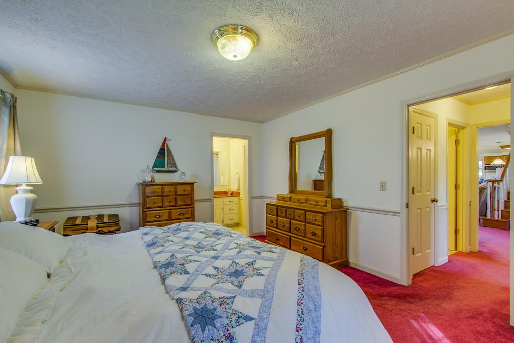 2352 Tom Fitzgerald Road Columbia, TN 38401 - Photo 16 of 30 a bedroom with a bed and a cabinets