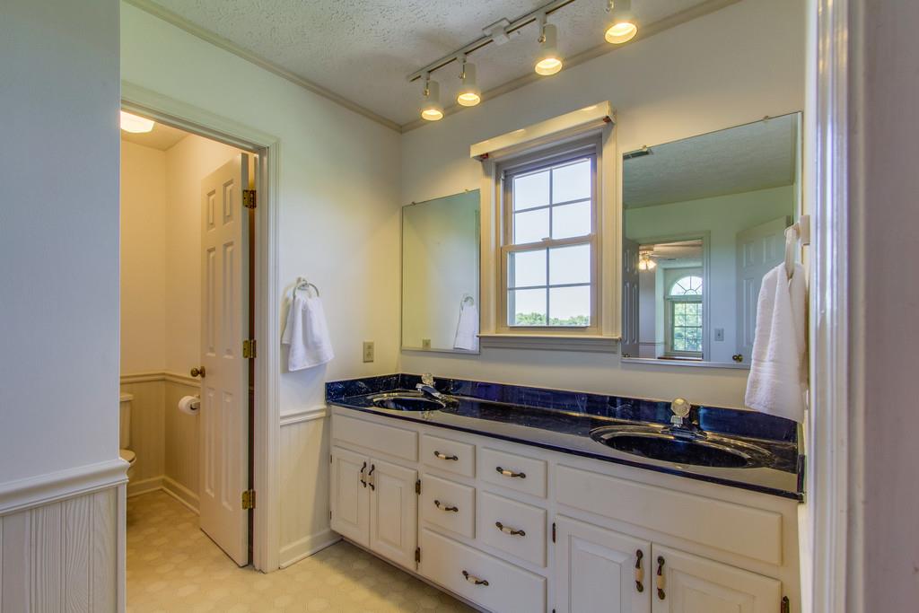 2352 Tom Fitzgerald Road Columbia, TN 38401 - Photo 21 of 30 a bathroom with double sink and a mirror