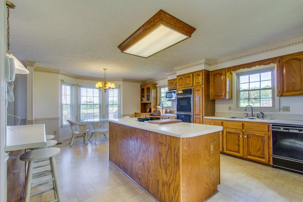 2352 Tom Fitzgerald Road Columbia, TN 38401 - Photo 7 of 30 a large kitchen with kitchen island a large island in it