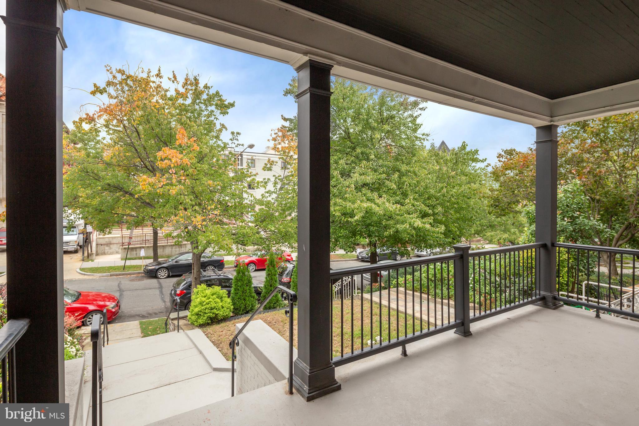 1230 Fairmont Street Northwest, Unit 2 Washington, DC 20009 - Photo 2 of 21 a view of a building and bench in the balcony