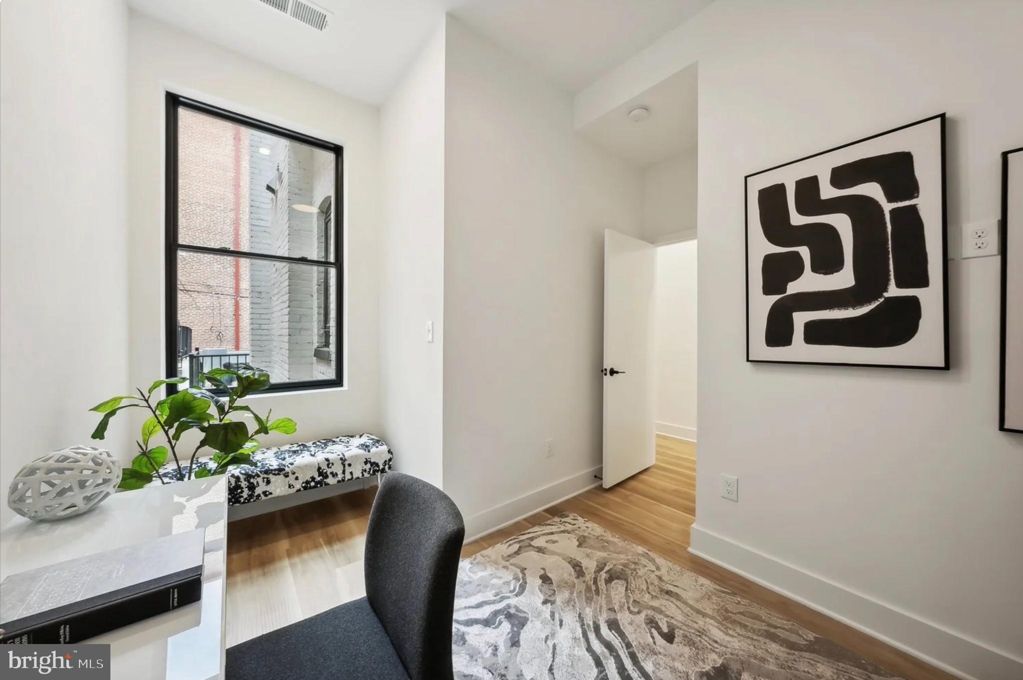 2015 13th Street Northwest, Unit 2 Washington, DC 20009 - Photo 20 of 40 a bedroom with a bed and a potted plant