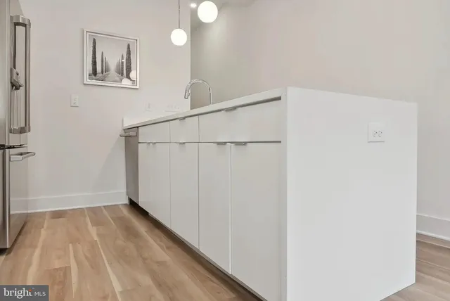 a view of a hallway with washer and dryer