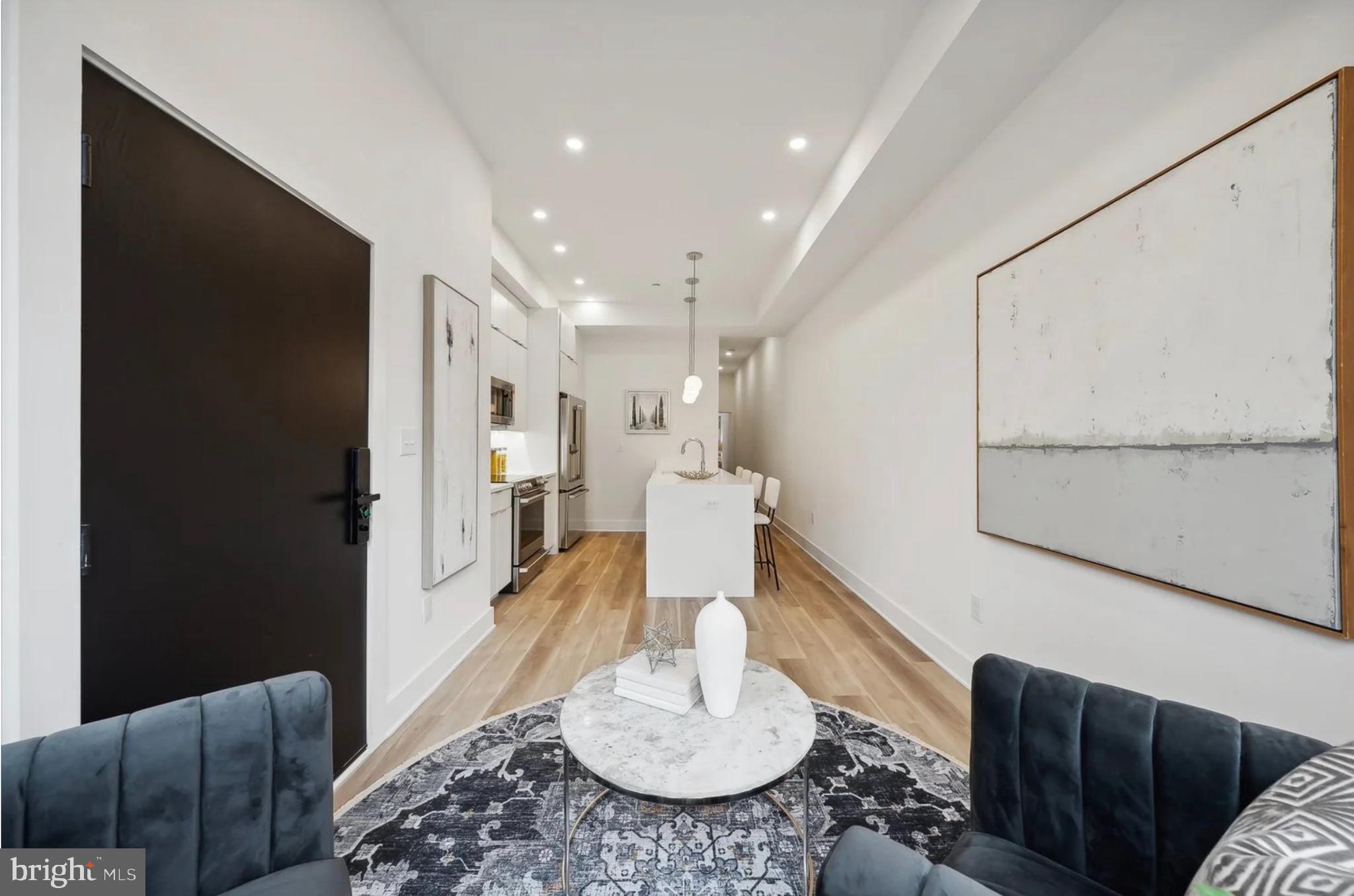 2015 13th Street Northwest, Unit 2 Washington, DC 20009 - Photo 8 of 40 a living room with furniture and a wooden floor
