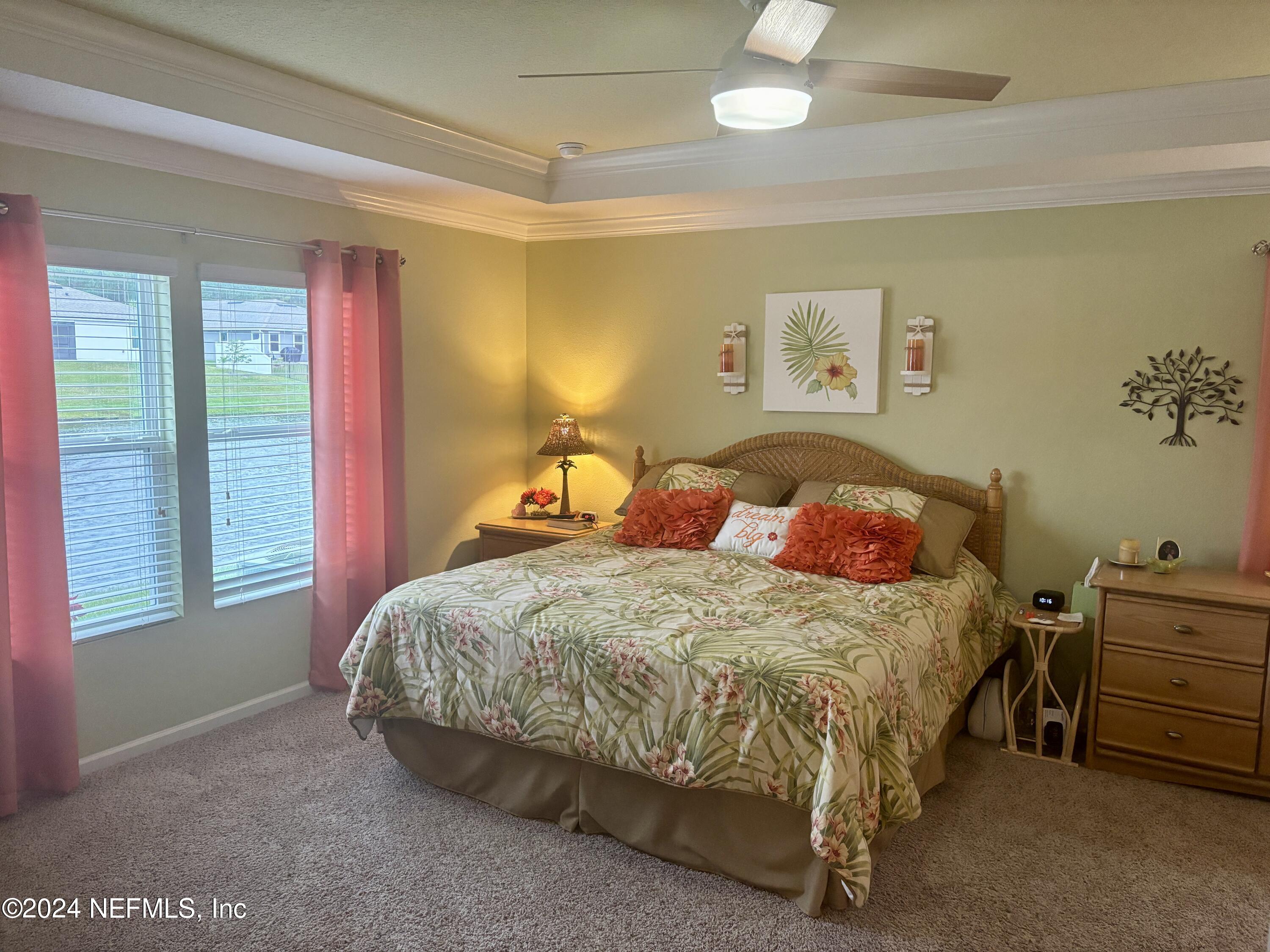 277 Palace Drive St. Augustine, FL 32084 - Photo 11 of 36 a bedroom with a bed and a window