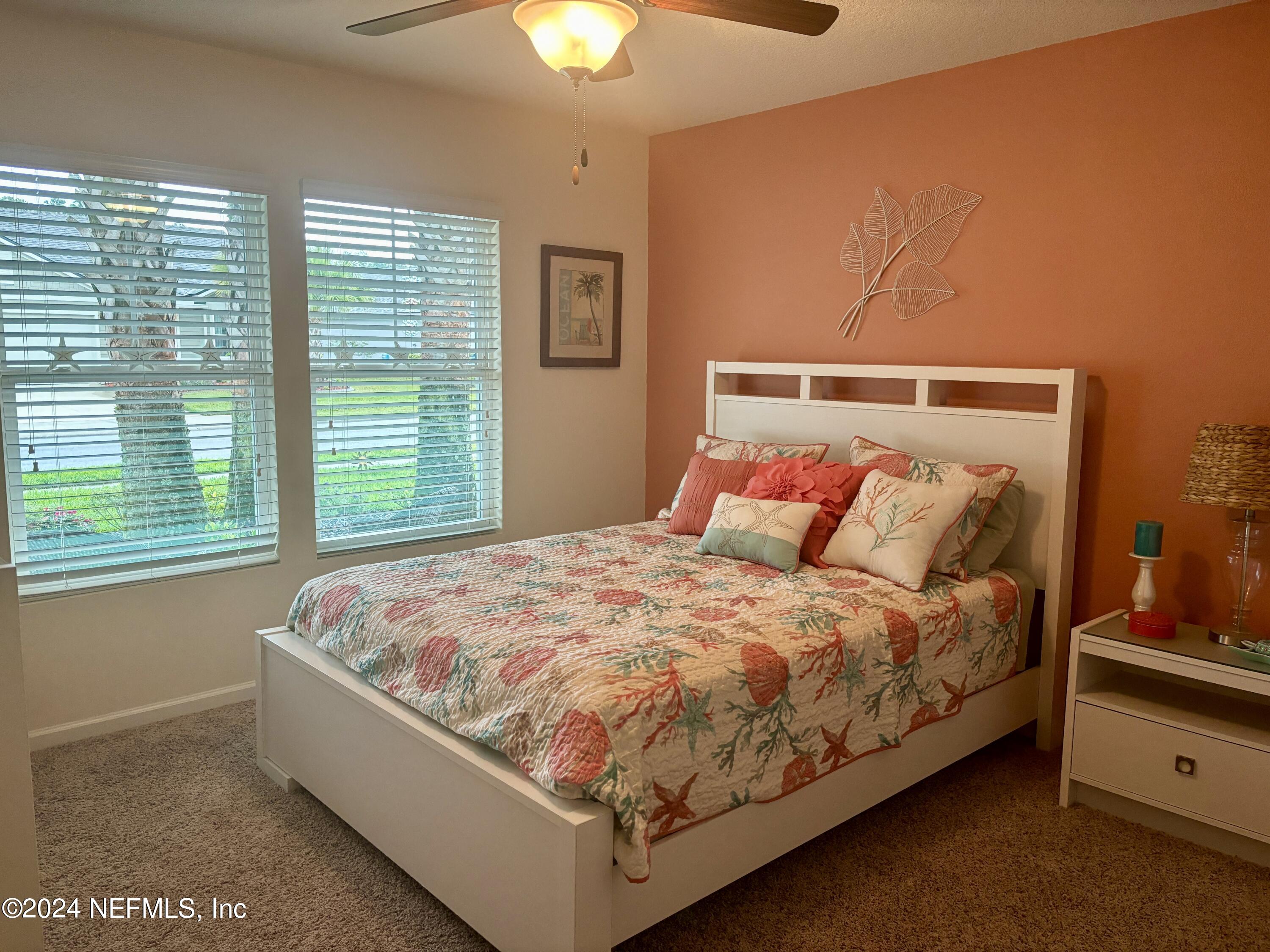 277 Palace Drive St. Augustine, FL 32084 - Photo 13 of 36 a bed sitting in a bedroom next to a window