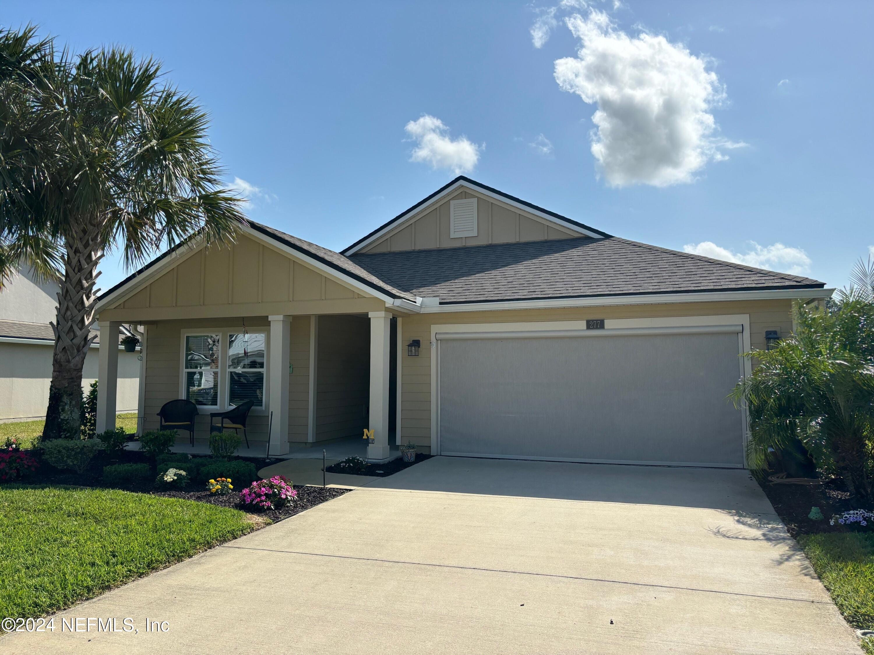 277 Palace Drive St. Augustine, FL 32084 - Photo 16 of 36 a front view of a house with garden