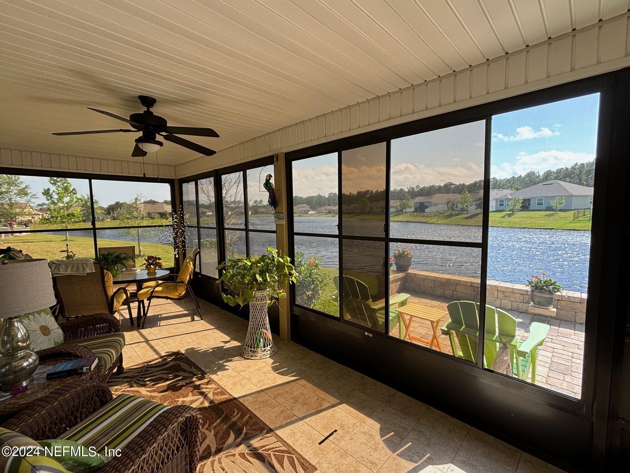 277 Palace Drive St. Augustine, FL 32084 - Photo 3 of 36 a living room with hardwood floor and large windows
