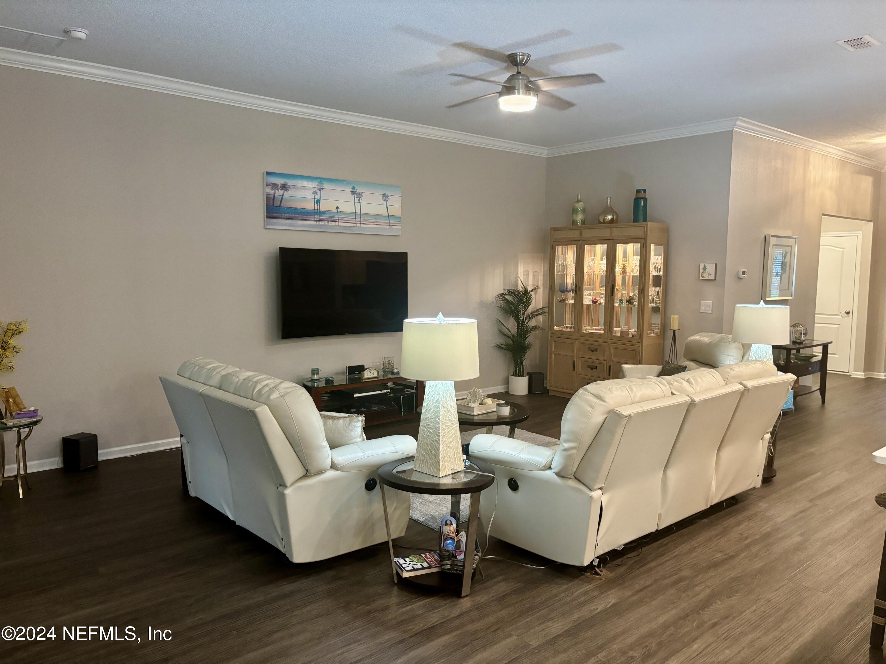 277 Palace Drive St. Augustine, FL 32084 - Photo 6 of 36 a living room with fireplace furniture and a flat screen tv