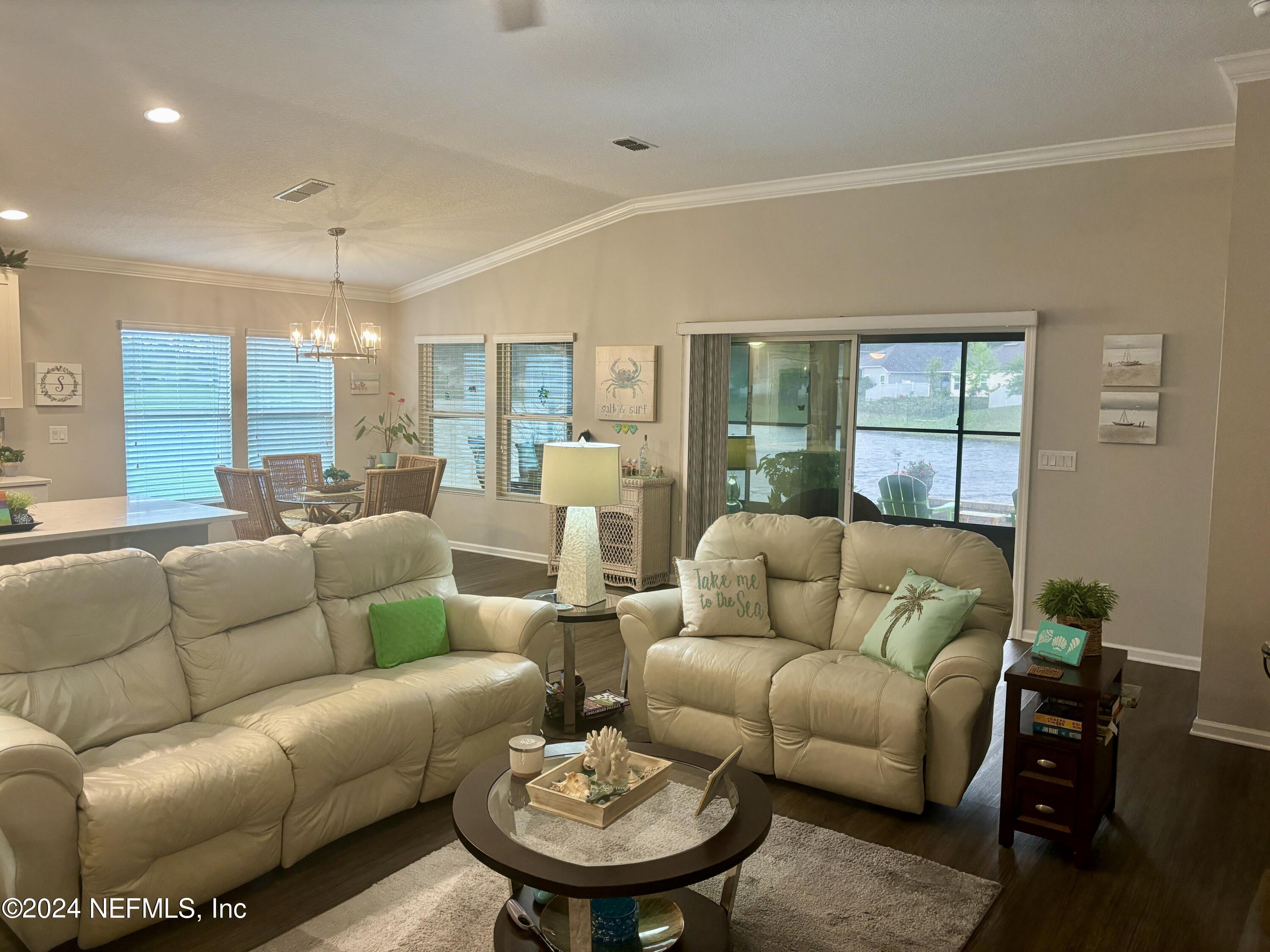 277 Palace Drive St. Augustine, FL 32084 - Photo 8 of 36 a living room with furniture and a large window